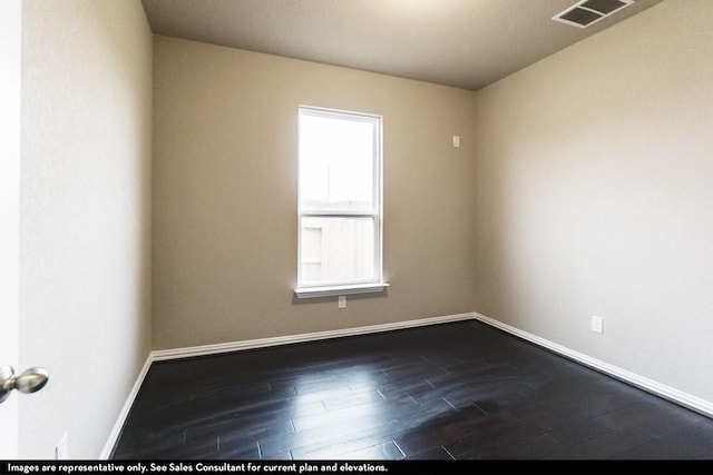 unfurnished room with dark wood-type flooring