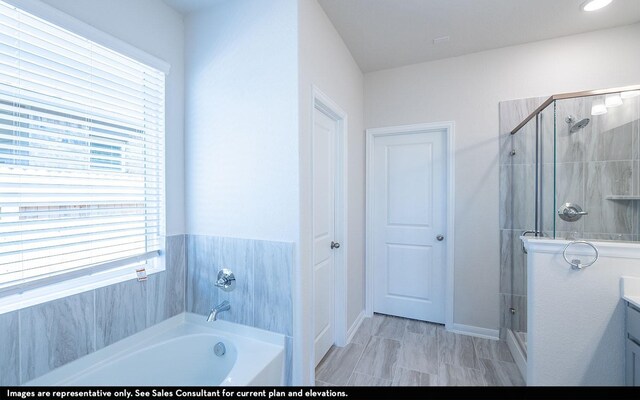 2476 Fairway Harbor Dr, Katy, TX 77493 - full bathroom with a shower stall, a garden tub, vanity, and baseboards