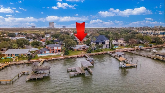 birds eye view of property featuring a water view