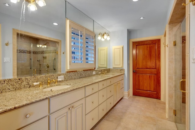 bathroom featuring vanity, tile patterned floors, and walk in shower