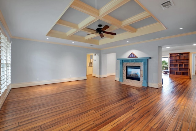 unfurnished living room featuring hardwood / wood-style floors, beamed ceiling, a premium fireplace, ceiling fan, and coffered ceiling