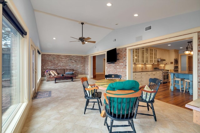 interior space with ceiling fan and exterior kitchen