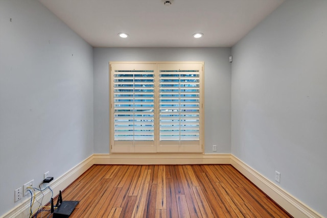 spare room featuring hardwood / wood-style flooring