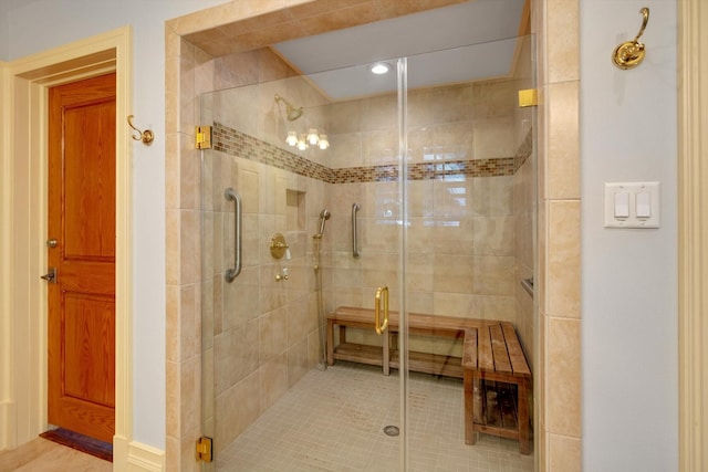 bathroom with tile patterned floors and a shower with shower door