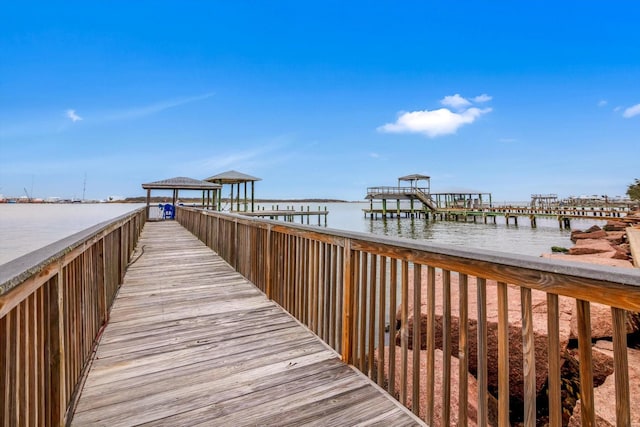 dock area featuring a gazebo and a water view