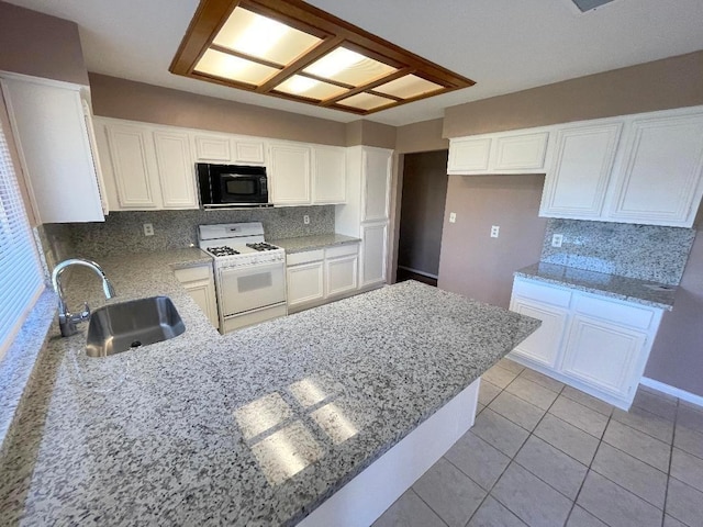 kitchen with sink, white cabinetry, and gas range gas stove