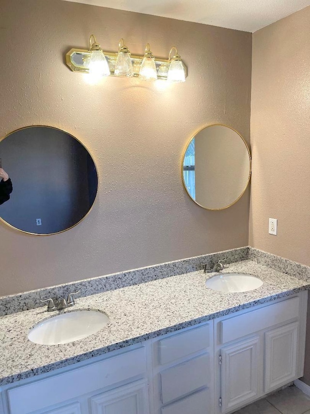 bathroom featuring tile patterned floors and vanity