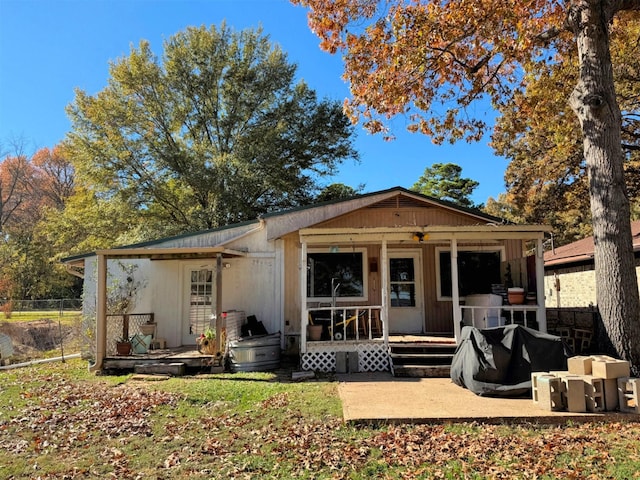 back of house with a porch