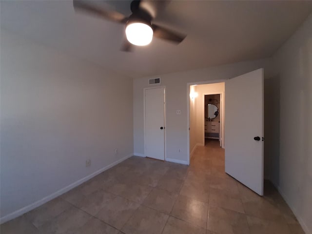 unfurnished bedroom featuring ceiling fan and light tile patterned floors