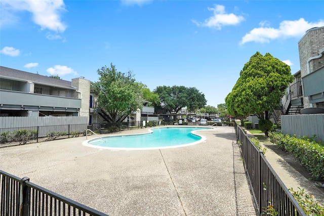 view of swimming pool with a patio