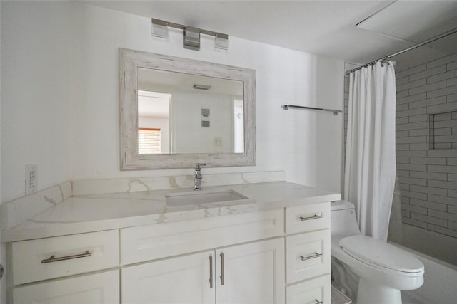 bathroom with toilet and vanity