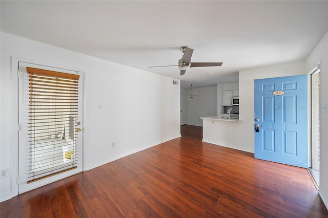 interior space featuring dark wood-type flooring, sink, plenty of natural light, and ceiling fan