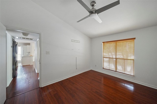 unfurnished room with ceiling fan, dark hardwood / wood-style floors, and vaulted ceiling