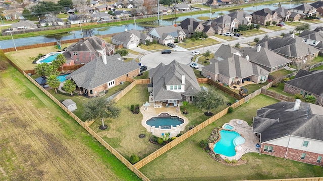 birds eye view of property featuring a water view