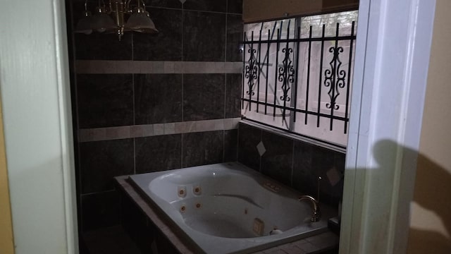 bathroom with tiled tub