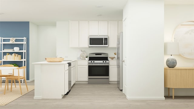 kitchen with kitchen peninsula, appliances with stainless steel finishes, white cabinetry, and light hardwood / wood-style floors