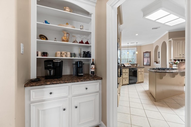 interior space featuring pendant lighting, black appliances, light tile patterned flooring, crown molding, and dark stone counters