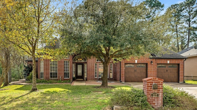 view of front of home with a front lawn and a garage