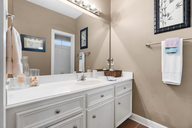 bathroom featuring wood-type flooring and vanity