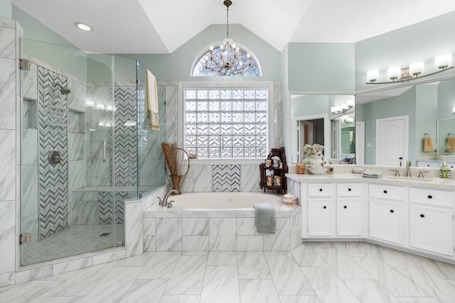 bathroom featuring lofted ceiling, vanity, separate shower and tub, and a chandelier