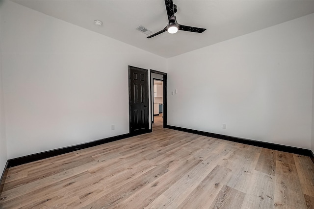 spare room with ceiling fan and light hardwood / wood-style flooring