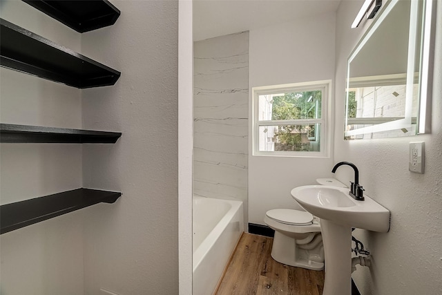 bathroom featuring toilet and hardwood / wood-style flooring