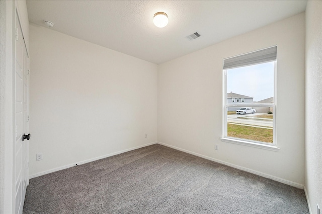 unfurnished room featuring carpet flooring