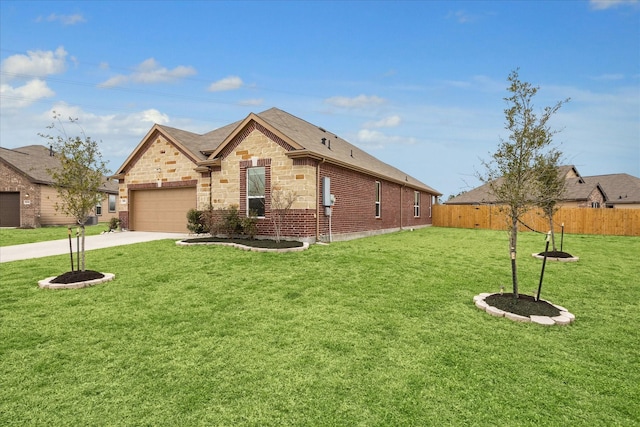 view of front of home featuring a garage and a front lawn