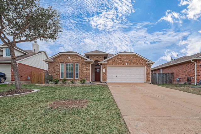 view of front of house with a garage and a front yard