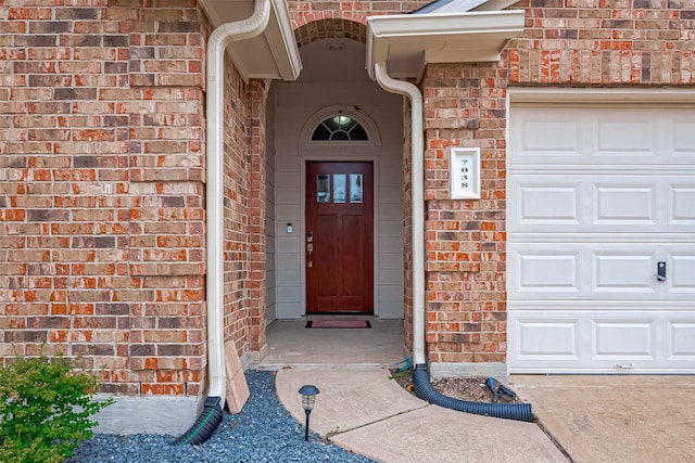 entrance to property featuring a garage