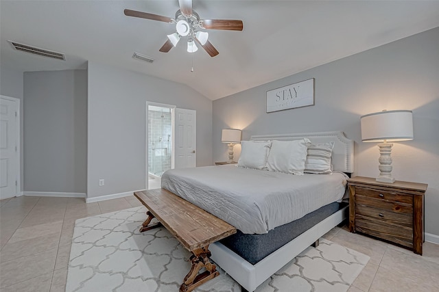 bedroom with connected bathroom, light tile patterned floors, lofted ceiling, and ceiling fan