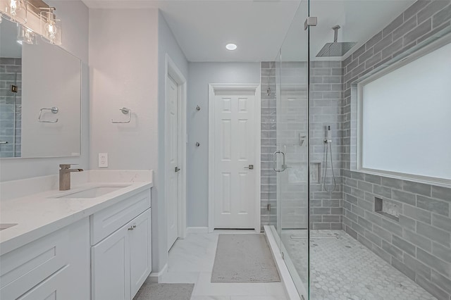 bathroom with vanity and walk in shower