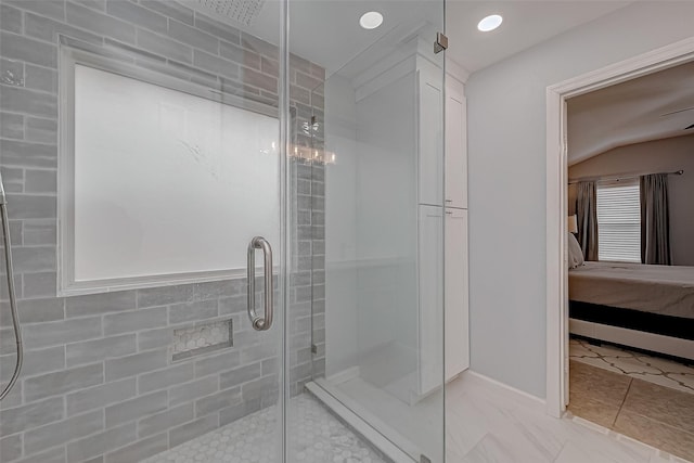 bathroom with a shower with shower door