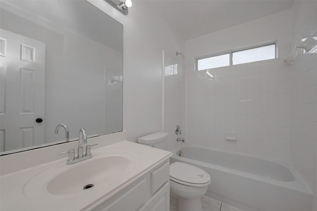 full bathroom featuring tiled shower / bath combo, vanity, and toilet