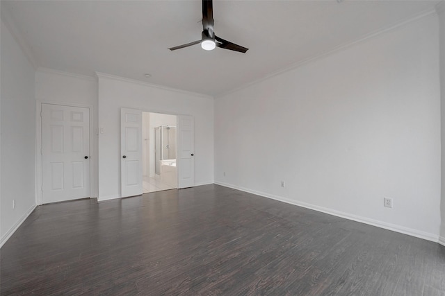 spare room with crown molding, dark hardwood / wood-style floors, and ceiling fan