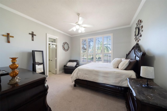 bedroom featuring ceiling fan, ornamental molding, and light carpet