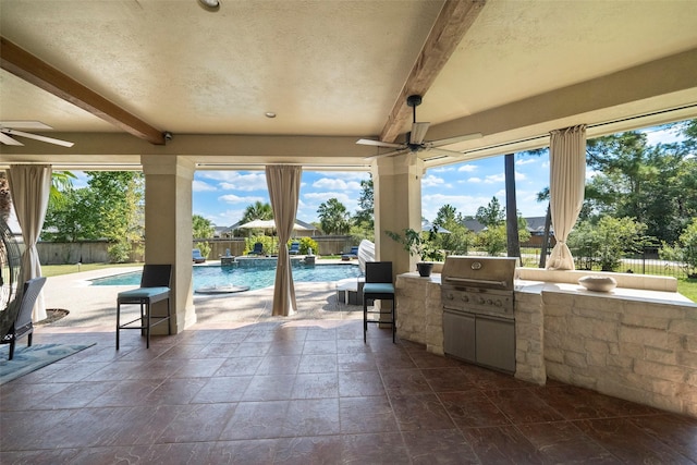 view of patio / terrace with a grill, a fenced in pool, exterior bar, ceiling fan, and area for grilling