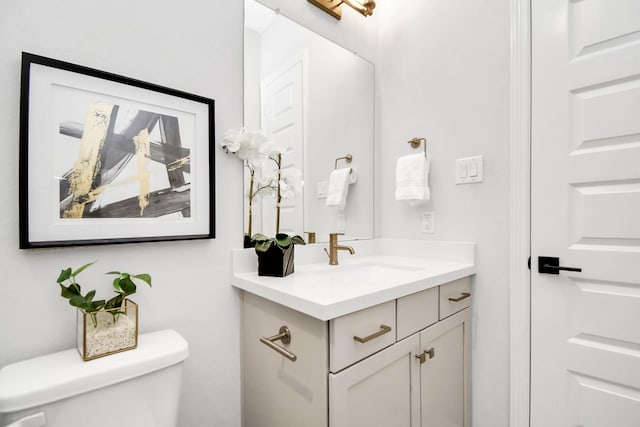 bathroom with toilet and vanity