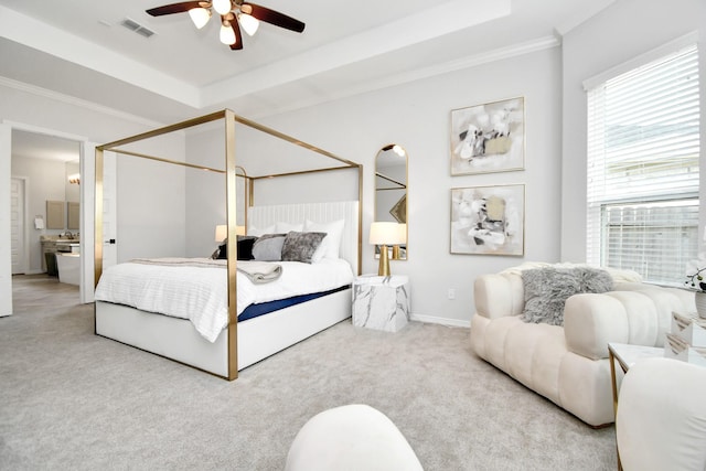 bedroom with ceiling fan, light carpet, crown molding, and a tray ceiling