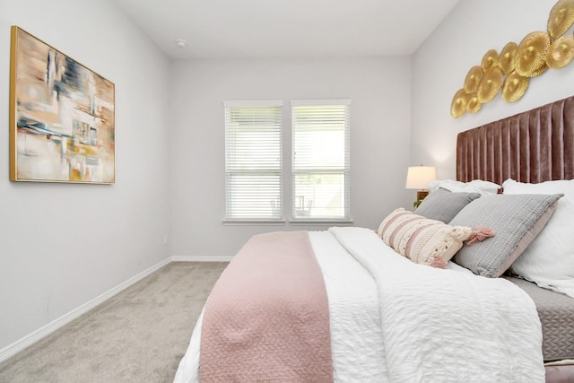 bedroom featuring light carpet