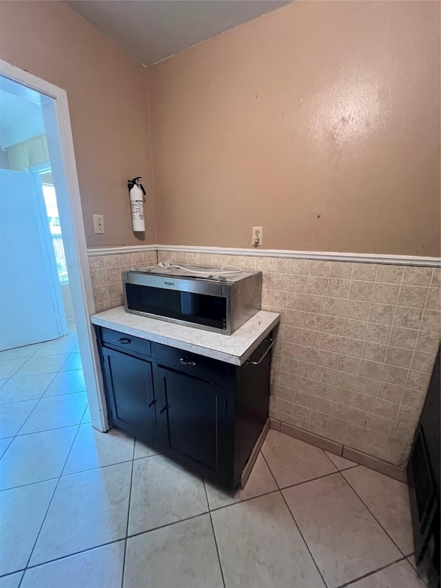 bathroom featuring tile walls and tile patterned floors