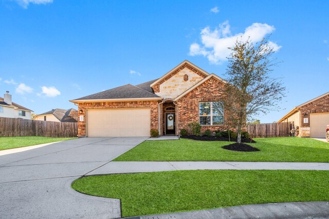 view of front of house featuring a garage and a front lawn