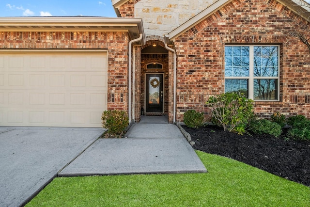 view of front of house featuring brick siding and an attached garage