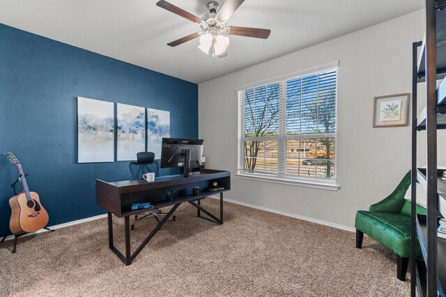 carpeted office space with ceiling fan