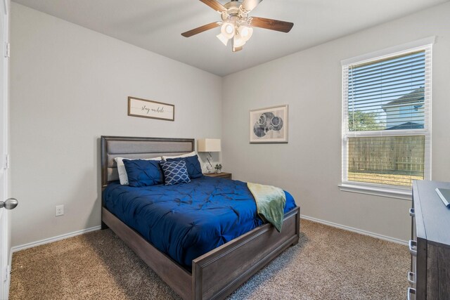 bedroom featuring ceiling fan and carpet flooring