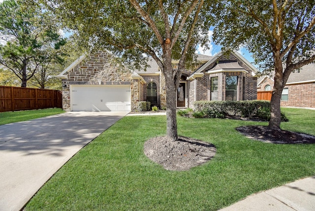 view of front of house with a garage and a front yard