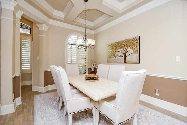 dining area with coffered ceiling, plenty of natural light, ornamental molding, and decorative columns