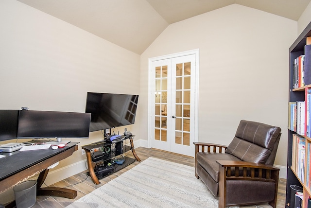 home office featuring vaulted ceiling and french doors