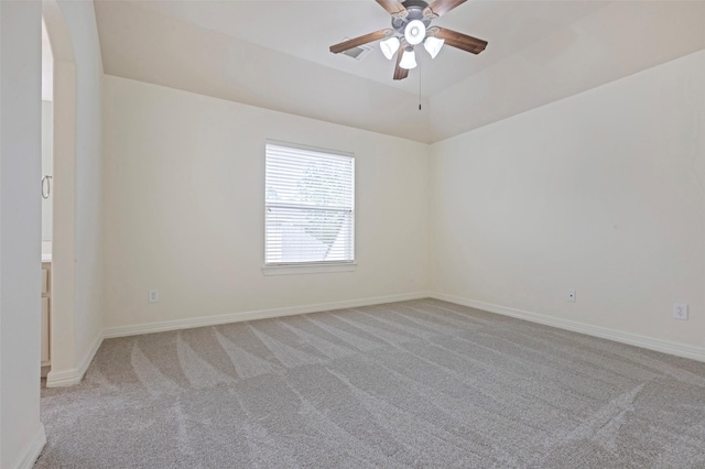 unfurnished room with ceiling fan, light colored carpet, and lofted ceiling