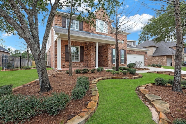 view of front of house featuring a garage and a front yard